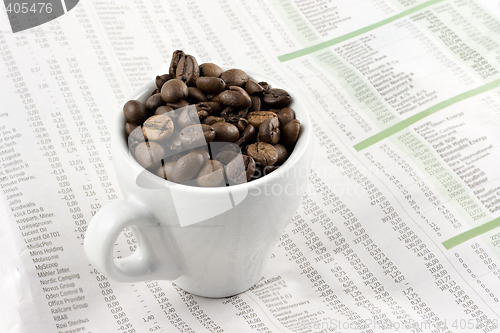 Image of Classic espresso cup on financial pages