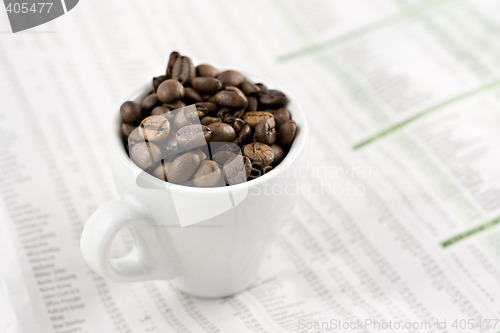 Image of Classic espresso cup on financial pages