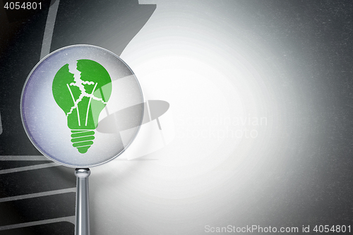 Image of Business concept:  Light Bulb with optical glass on digital background