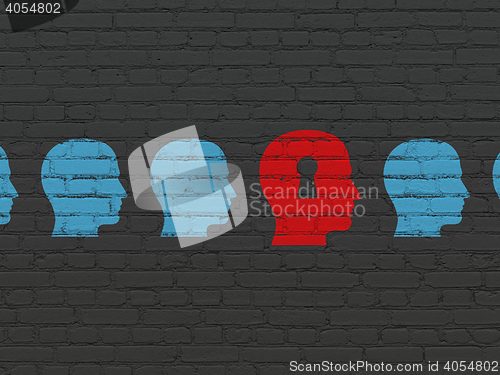 Image of Finance concept: head with keyhole icon on wall background