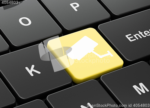 Image of Protection concept: Cctv Camera on computer keyboard background