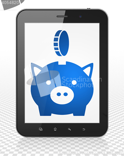 Image of Banking concept: Tablet Pc Computer with Money Box With Coin on display