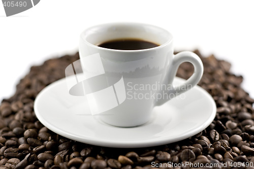 Image of Classic white espresso cup on coffee beans
