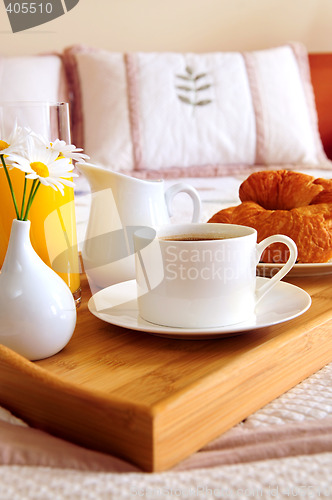 Image of Breakfast on a bed in a hotel room