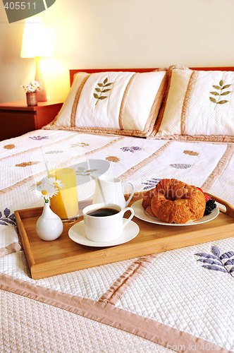 Image of Breakfast on a bed in a hotel room