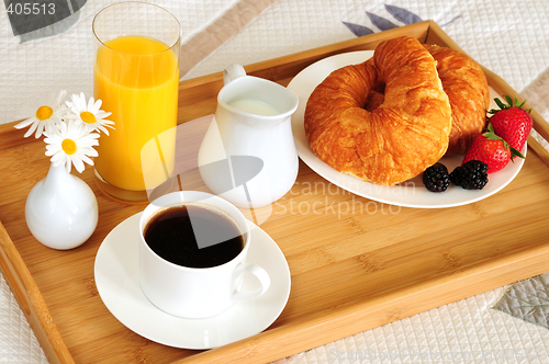 Image of Breakfast on a bed in a hotel room