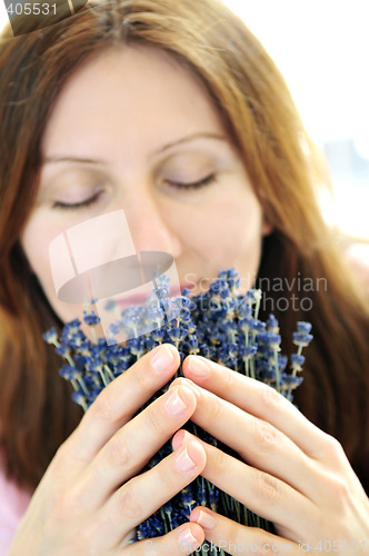 Image of Woman smelling lavender