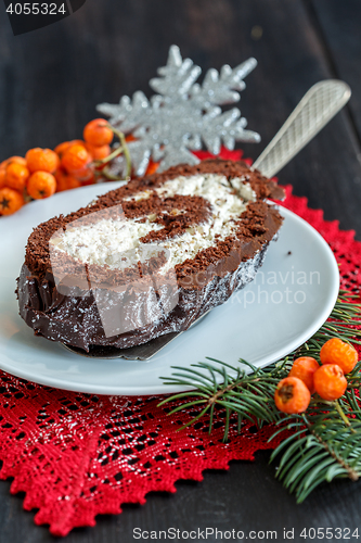 Image of Sliced homemade Christmas chocolate yule log.