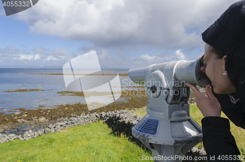 Image of Girl looking through spyglass