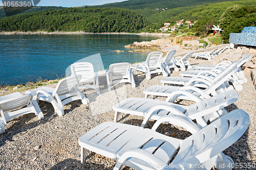 Image of Pebble beach with chaise-longues in Istria