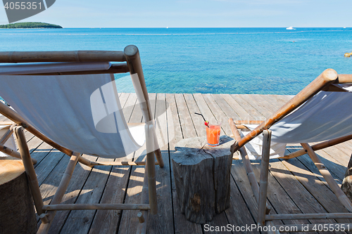 Image of Wooden floor with chaise-longues in Istria