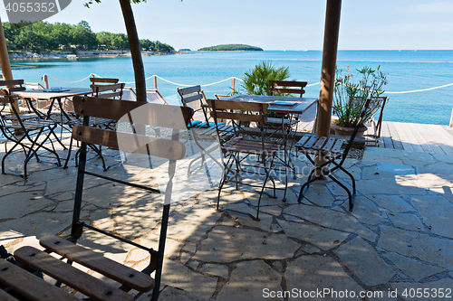 Image of Chairs and tables with beautiful sea view