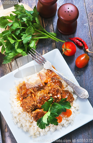 Image of boiled rice with sauce