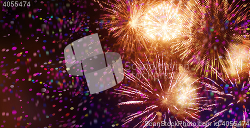 Image of bright sparkling multicolor fireworks and confetti