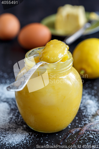 Image of Jar with lemon custard, lemon, egg.