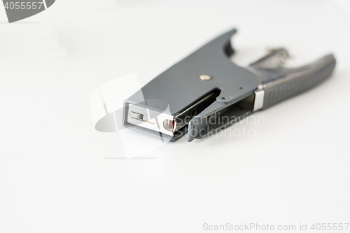 Image of gray stapler on a white plain