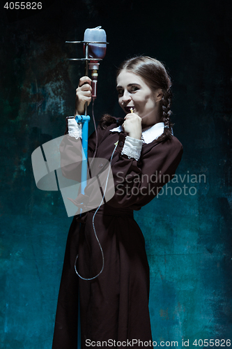 Image of Portrait of a young girl in school uniform as a vampire woman