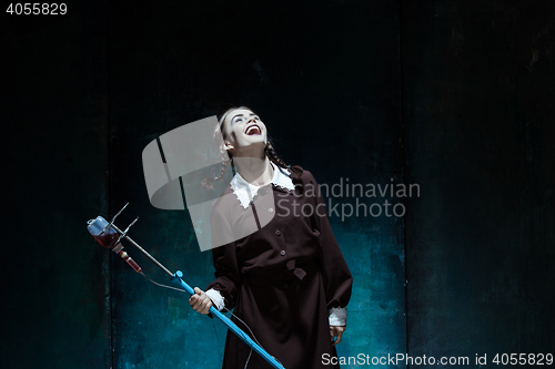 Image of Portrait of a young girl in school uniform as a vampire woman