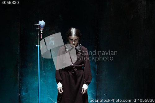 Image of Portrait of a young girl in school uniform as a vampire woman