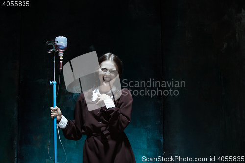 Image of Portrait of a young girl in school uniform as a vampire woman