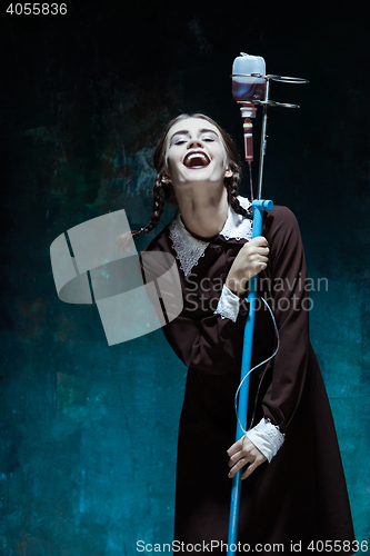 Image of Portrait of a young girl in school uniform as a vampire woman