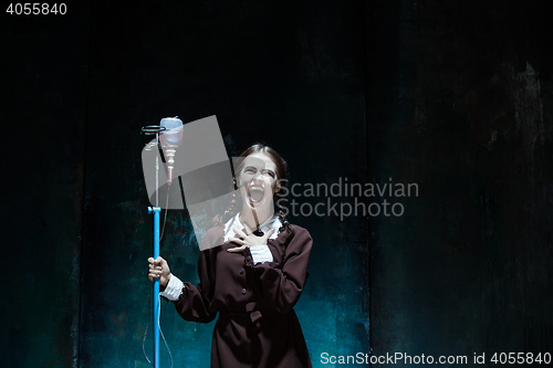 Image of Portrait of a young girl in school uniform as a vampire woman