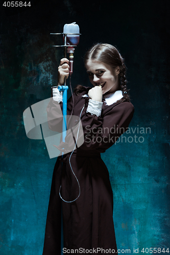 Image of Portrait of a young girl in school uniform as a vampire woman