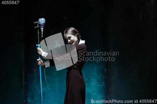 Image of Portrait of a young girl in school uniform as a vampire woman