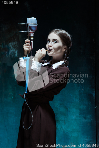 Image of Portrait of a young girl in school uniform as a vampire woman