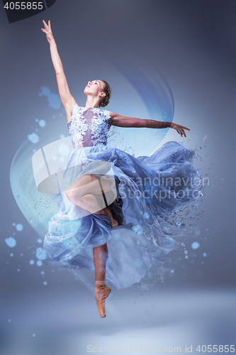 Image of The beautiful ballerina dancing in blue long dress 