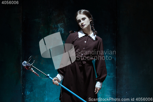 Image of Portrait of a young girl in school uniform as a vampire woman