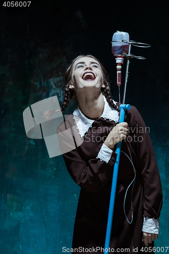 Image of Portrait of a young girl in school uniform as a vampire woman