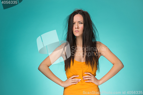 Image of Frustrated young woman having a bad hair