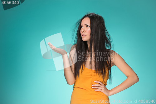 Image of Frustrated young woman having a bad hair