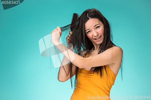 Image of Frustrated young woman having a bad hair