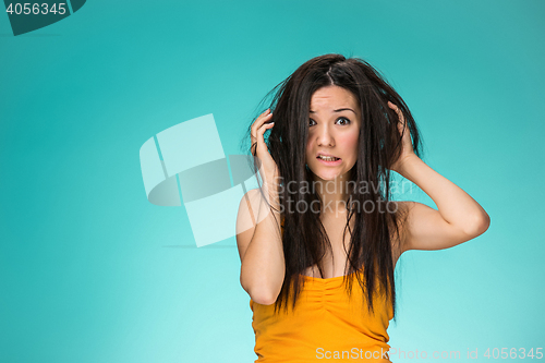 Image of Frustrated young woman having a bad hair