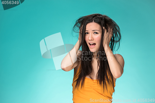 Image of Frustrated young woman having a bad hair