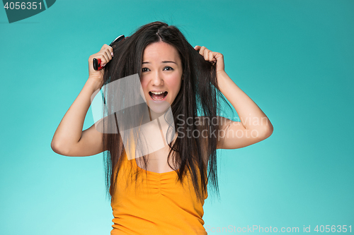 Image of Frustrated young woman having a bad hair