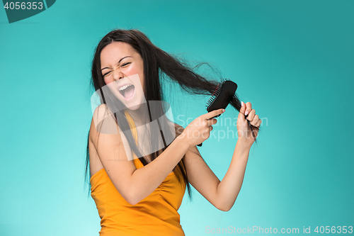 Image of Frustrated young woman having a bad hair
