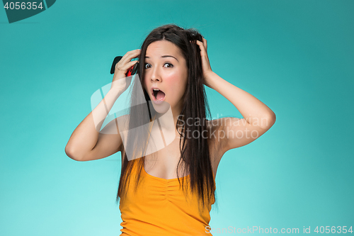 Image of Frustrated young woman having a bad hair