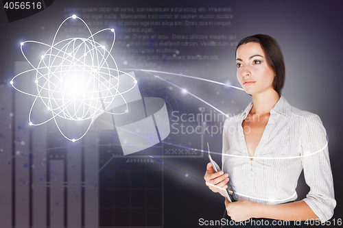 Image of Young business woman with laptop