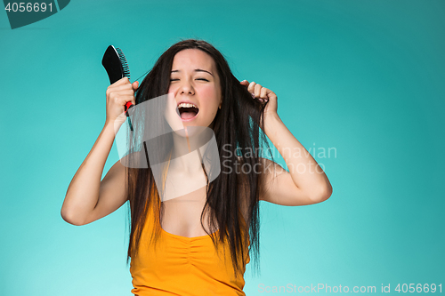 Image of Frustrated young woman having a bad hair