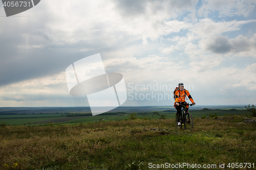 Image of Young man is riding bicycle outside. Healthy Lifestyle.