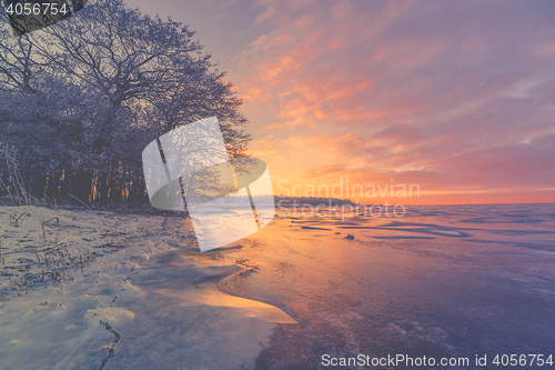 Image of Violet sunrise over a frozen lake