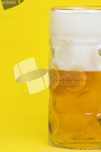 Image of beer mug on yellow