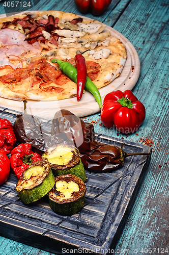 Image of Pizza and baked vegetables
