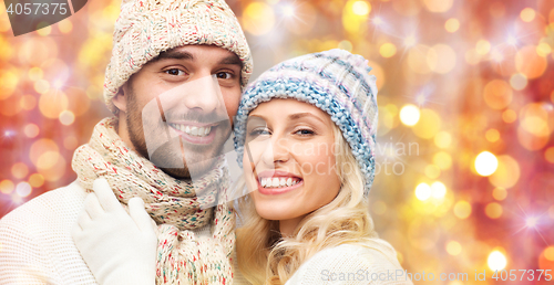 Image of close up of couple in winter clothes hugging