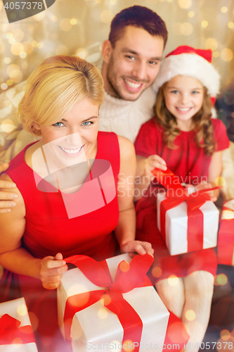 Image of happy family opening gift boxes