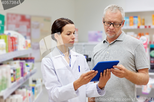 Image of pharmacist with tablet pc and senior man