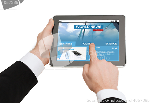 Image of close up of hands with business news on tablet pc